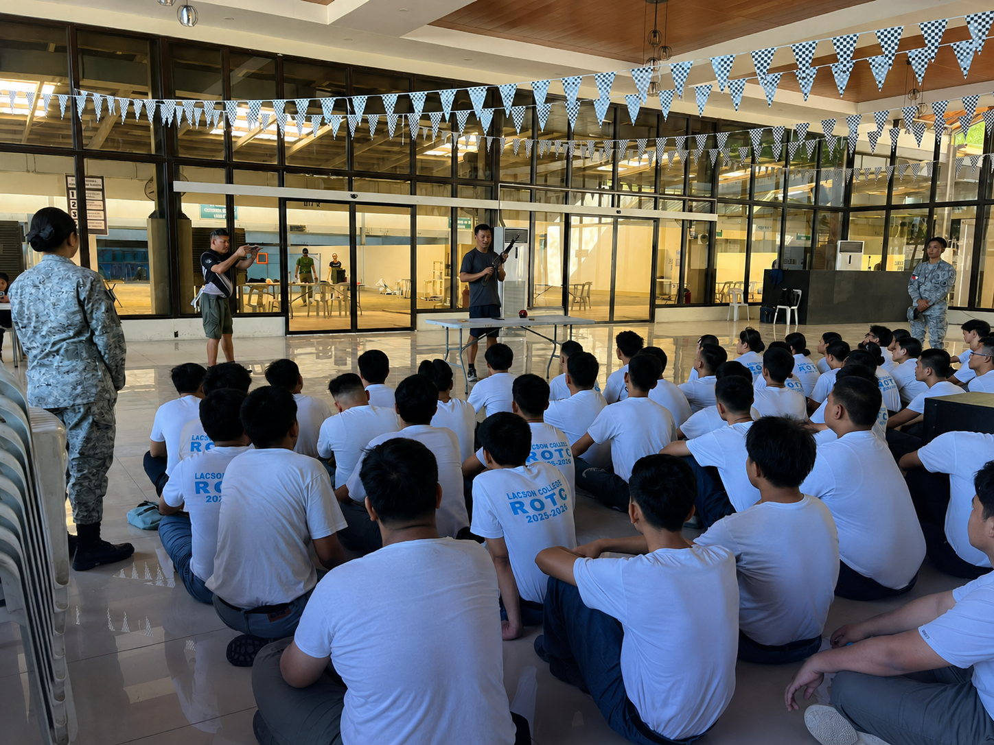 Lacson College criminology students seated during a classroom-based formation activity