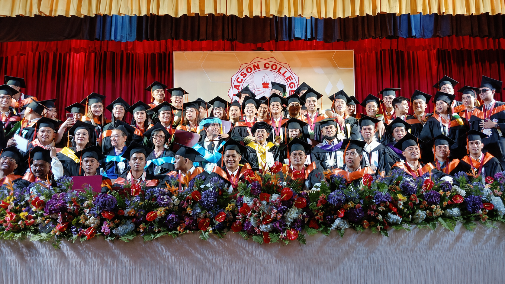 Lacson College graduates and faculty gathered for a graduation and recognition photo